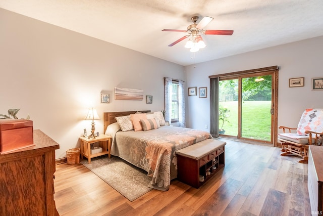 5003 N Chatham Dr, Bloomington, IN 47404 - bedroom with access to outside, light wood finished floors, and ceiling fan