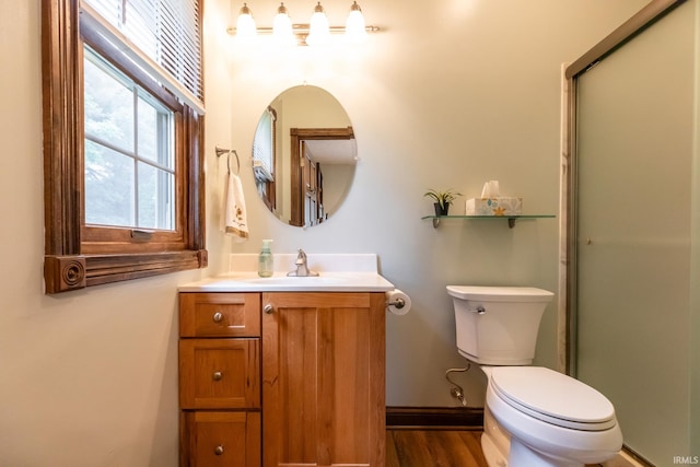 5003 N Chatham Dr, Bloomington, IN 47404 - full bathroom featuring vanity, toilet, a stall shower, wood finished floors, and baseboards
