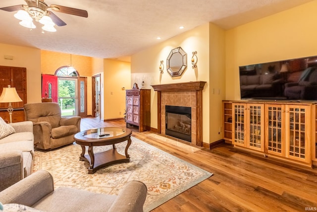 5003 N Chatham Dr, Bloomington, IN 47404 - living area featuring ceiling fan, wood finished floors, a fireplace, recessed lighting, and baseboards