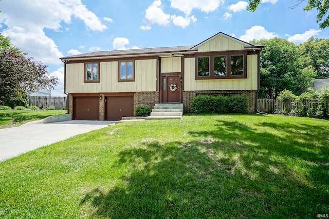 60 Elder Ct, Lafayette, IN 47905 - split foyer home with a garage, brick siding, and driveway