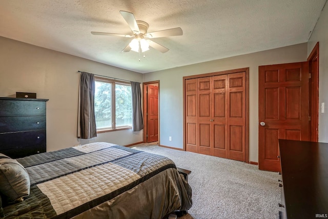 60 Elder Ct, Lafayette, IN 47905 - bedroom featuring carpet flooring, a closet, baseboards, a textured ceiling, and a ceiling fan