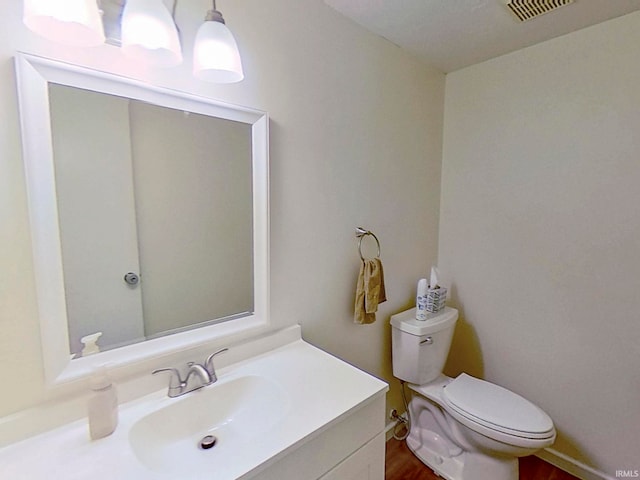 60 Elder Ct, Lafayette, IN 47905 - bathroom with toilet, vanity, and wood finished floors