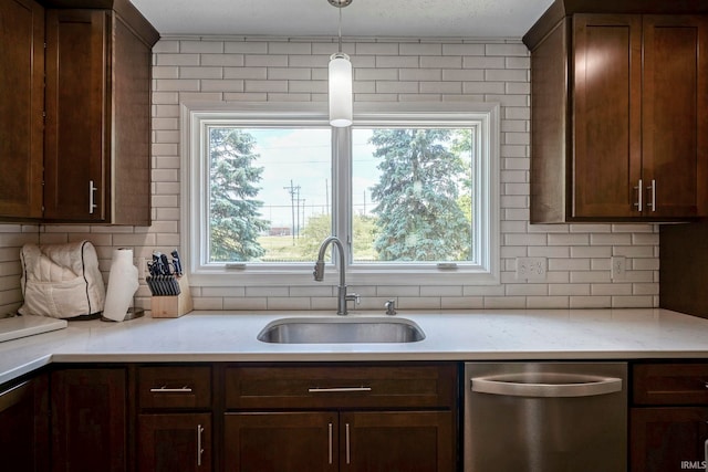 60 Elder Ct, Lafayette, IN 47905 - kitchen with dishwasher, a sink, light countertops, decorative backsplash, and healthy amount of natural light