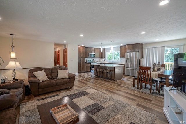 60 Elder Ct, Lafayette, IN 47905 - living room with wood finished floors, recessed lighting, and a textured ceiling
