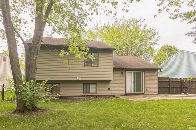 11114 E Wismar Dr, Indianapolis, IN 46235 - back of property with a patio area and roof with shingles