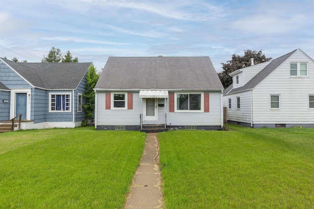 2806 Milburn Blvd, Mishawaka, IN 46544 - cape cod house with entry steps, a front yard, and a shingled roof