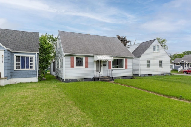 2806 Milburn Blvd, Mishawaka, IN 46544 - new england style home featuring a front yard and roof with shingles
