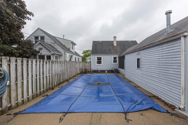 2806 Milburn Blvd, Mishawaka, IN 46544 - view of pool featuring a fenced backyard, a patio, and central AC