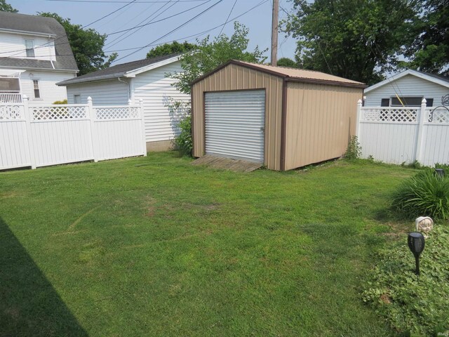 801 E Sycamore St, Petersburg, IN 47567 - view of yard featuring an outbuilding and a detached garage