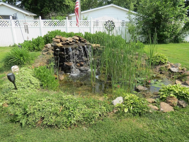 801 E Sycamore St, Petersburg, IN 47567 - view of yard with a garden pond
