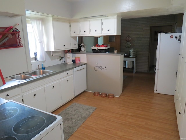 801 E Sycamore St, Petersburg, IN 47567 - kitchen with white appliances, a sink, and light wood finished floors