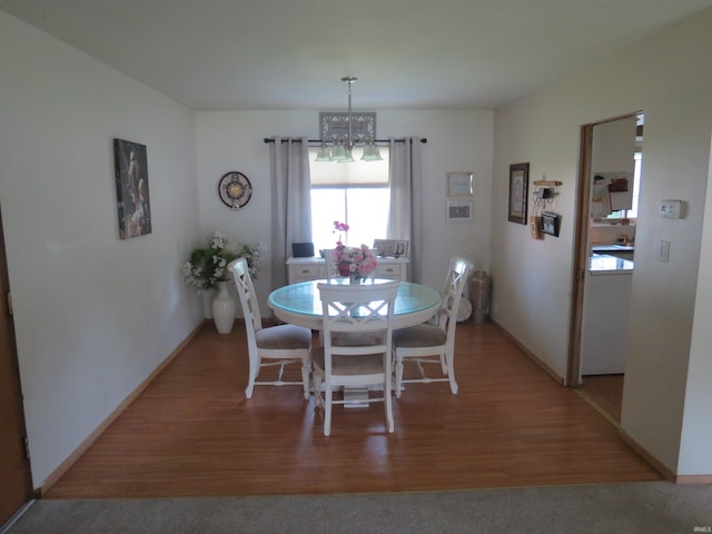 801 E Sycamore St, Petersburg, IN 47567 - dining area featuring a chandelier, light wood-type flooring, and baseboards