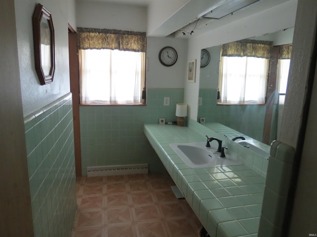 801 E Sycamore St, Petersburg, IN 47567 - bathroom with healthy amount of natural light, a baseboard heating unit, tile walls, rail lighting, and wainscoting