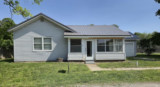 150 W Lake St, Laketon, IN 46943 - view of front of house with a front lawn and metal roof