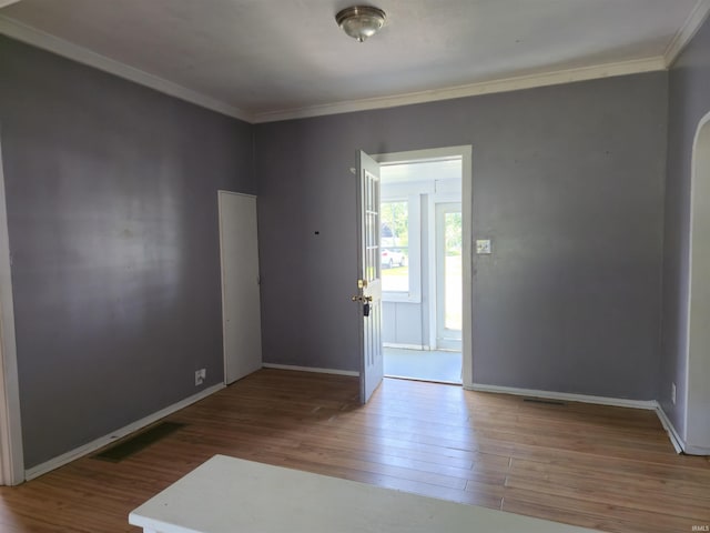 150 W Lake St, Laketon, IN 46943 - spare room with wood finished floors, ornamental molding, and baseboards