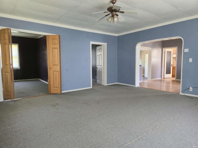 150 W Lake St, Laketon, IN 46943 - unfurnished room with carpet, ceiling fan, arched walkways, baseboards, and crown molding