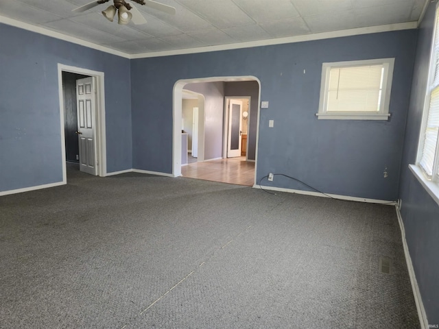 150 W Lake St, Laketon, IN 46943 - carpeted spare room with arched walkways, a ceiling fan, crown molding, and baseboards