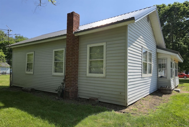 150 W Lake St, Laketon, IN 46943 - view of side of property with a chimney and metal roof