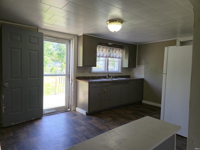 150 W Lake St, Laketon, IN 46943 - kitchen featuring freestanding refrigerator, a sink, dark wood finished floors, backsplash, and dark countertops