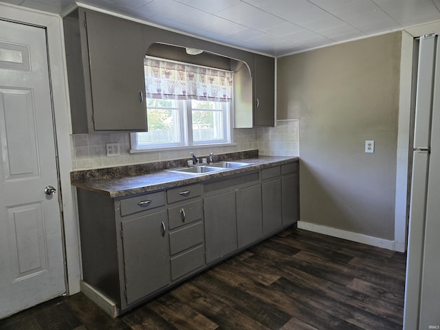 150 W Lake St, Laketon, IN 46943 - kitchen with a sink, gray cabinetry, dark countertops, tasteful backsplash, and dark wood-style flooring