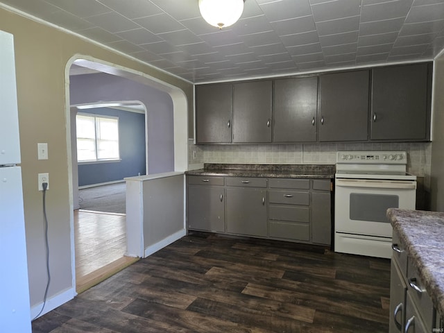 150 W Lake St, Laketon, IN 46943 - kitchen with white electric range, gray cabinetry, arched walkways, baseboards, and dark wood-style flooring