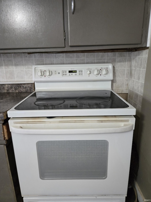 150 W Lake St, Laketon, IN 46943 - kitchen view of white range with electric stovetop and decorative backsplash