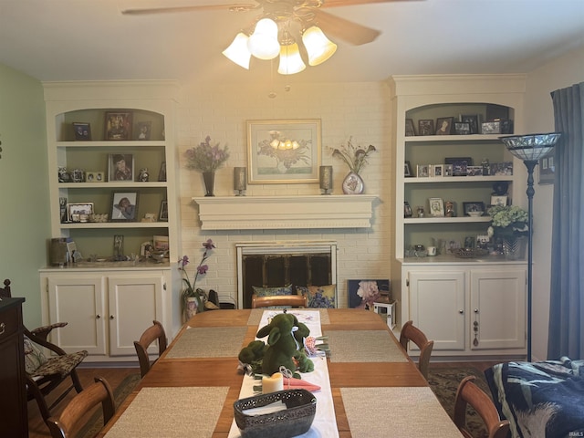 8133 Maple Ln, Newburgh, IN 47630 - dining room with a ceiling fan, built in shelves, and a brick fireplace