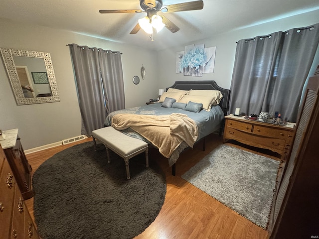 8133 Maple Ln, Newburgh, IN 47630 - bedroom featuring light wood-style floors, a ceiling fan, and baseboards