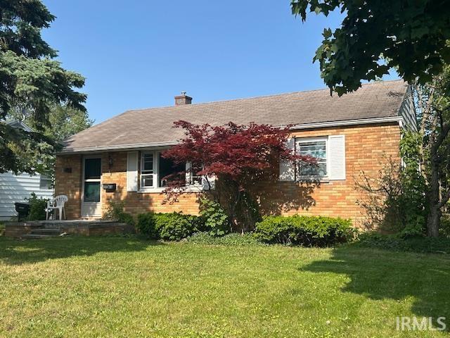 1612 N Wellington St, South Bend, IN 46628 - ranch-style home featuring a front lawn, brick siding, and a chimney