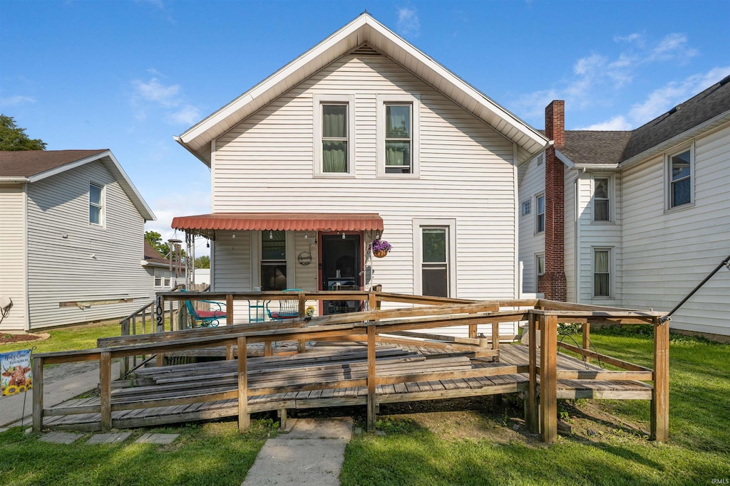 102 N Short Dr, Monroeville, IN 46773 - back of property with a deck and a chimney