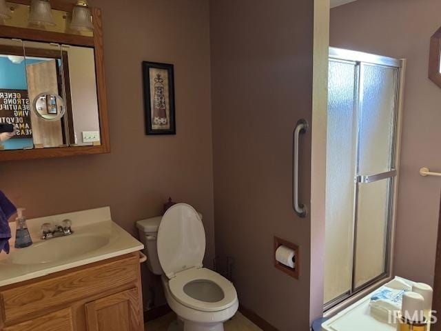 1402 E Culver Rd, Knox, IN 46534 - full bath featuring a shower stall, vanity, and toilet