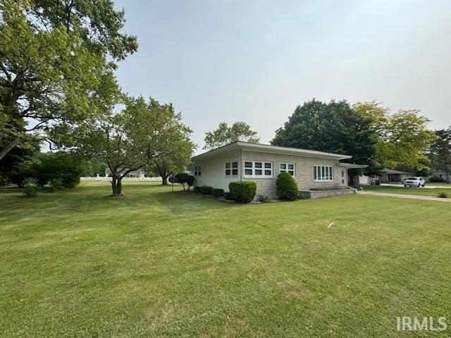 1402 E Culver Rd, Knox, IN 46534 - view of property exterior featuring a lawn