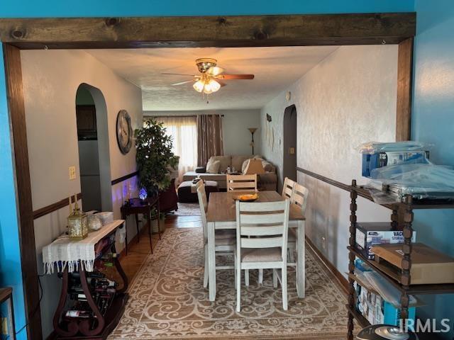 1402 E Culver Rd, Knox, IN 46534 - dining space featuring arched walkways, ceiling fan, wood finished floors, and beamed ceiling