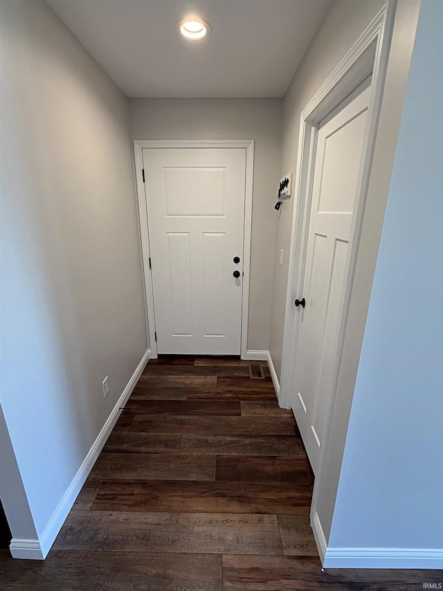 9 Deerfield Ln, Washington, IN 47501 - doorway to outside with dark wood-style floors, recessed lighting, and baseboards