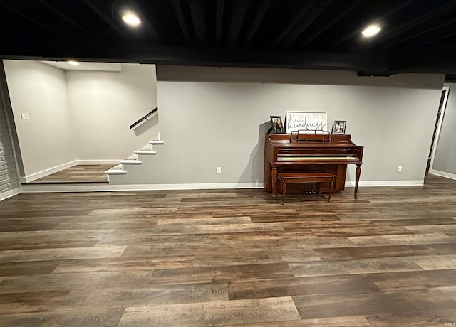 9 Deerfield Ln, Washington, IN 47501 - finished below grade area featuring wood finished floors, baseboards, stairs, and recessed lighting