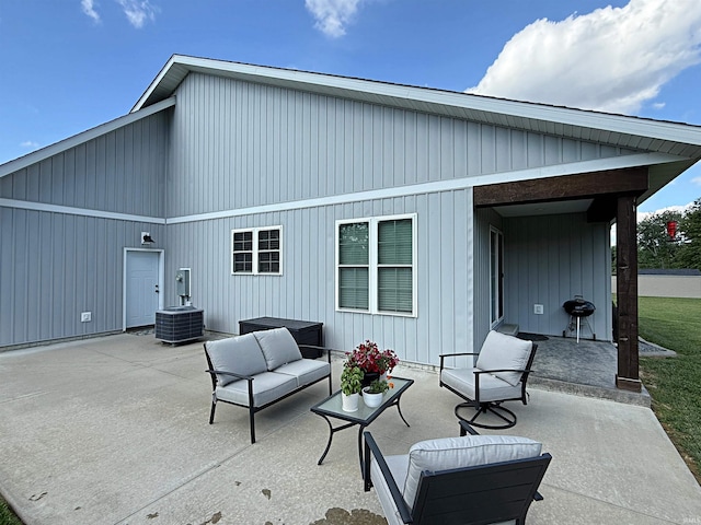9 Deerfield Ln, Washington, IN 47501 - back of property featuring a patio area, an outdoor living space, and cooling unit
