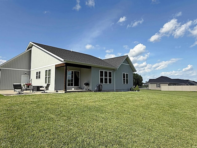 9 Deerfield Ln, Washington, IN 47501 - back of property with a patio and a lawn