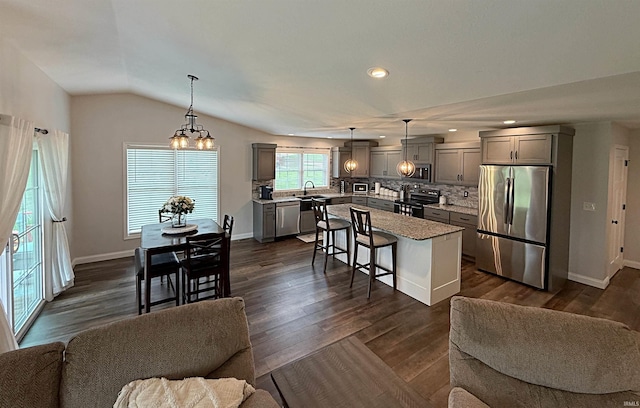 9 Deerfield Ln, Washington, IN 47501 - kitchen with stainless steel appliances, gray cabinetry, open floor plan, a kitchen bar, and recessed lighting