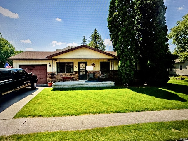 301 W Jefferson St, Columbia City, IN 46725 - view of front facade featuring a garage, a front yard, driveway, and covered porch