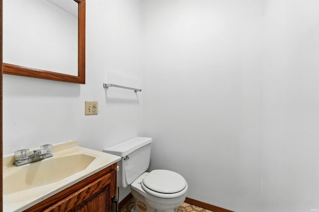 301 W Jefferson St, Columbia City, IN 46725 - half bathroom with toilet, vanity, and baseboards