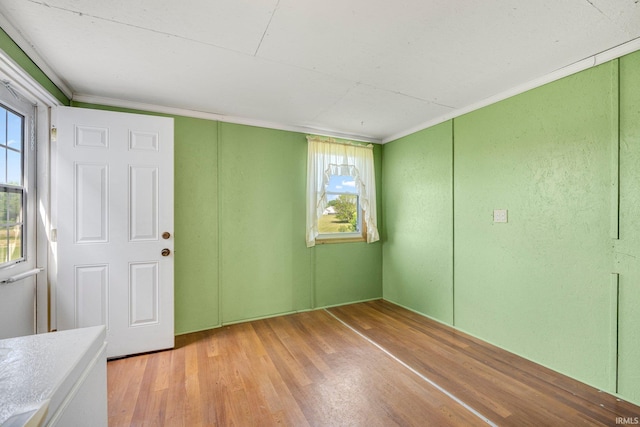 405 Miner Rd, Avilla, IN 46710 - spare room featuring wood finished floors, healthy amount of natural light, and crown molding