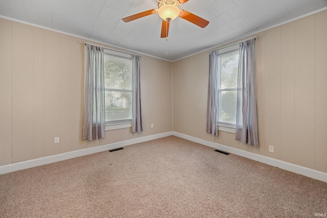 1804 Maple St, Lafayette, IN 47904 - carpeted empty room with plenty of natural light, ceiling fan, ornamental molding, and baseboards