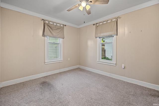 1804 Maple St, Lafayette, IN 47904 - carpeted spare room featuring healthy amount of natural light, a ceiling fan, crown molding, baseboards, and wooden walls