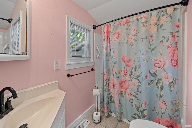 1804 Maple St, Lafayette, IN 47904 - bathroom featuring vaulted ceiling, vanity, baseboards, tile patterned floors, and toilet