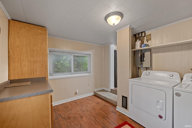 1804 Maple St, Lafayette, IN 47904 - laundry area featuring wood finished floors, electric panel, crown molding, washer and clothes dryer, and baseboards