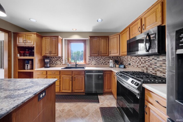 6811 Bittersweet Dells Ct, Fort Wayne, IN 46814 - kitchen featuring appliances with stainless steel finishes, a sink, decorative backsplash, light countertops, and recessed lighting