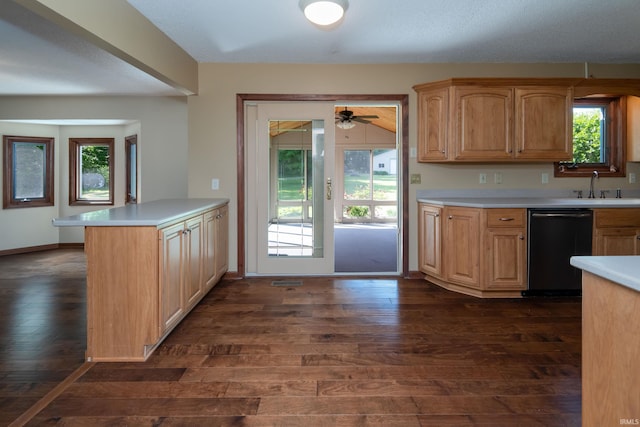 4431 Mccomb Rd, Huntertown, IN 46748 - kitchen with dishwasher, dark wood-style flooring, light countertops, and a sink