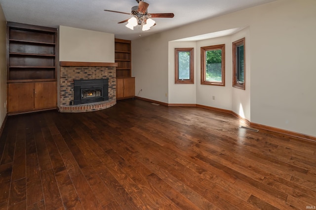 4431 Mccomb Rd, Huntertown, IN 46748 - unfurnished living room featuring a ceiling fan, hardwood / wood-style flooring, baseboards, and a brick fireplace