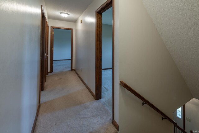 4431 Mccomb Rd, Huntertown, IN 46748 - hallway with light colored carpet and an upstairs landing