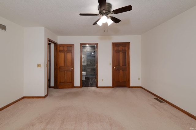 4431 Mccomb Rd, Huntertown, IN 46748 - spare room with light colored carpet, a ceiling fan, baseboards, and a textured ceiling